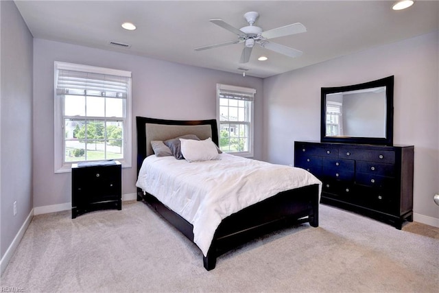 bedroom with baseboards, carpet, recessed lighting, and visible vents