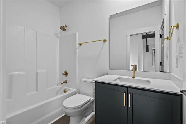 bathroom with vanity, bathing tub / shower combination, and toilet
