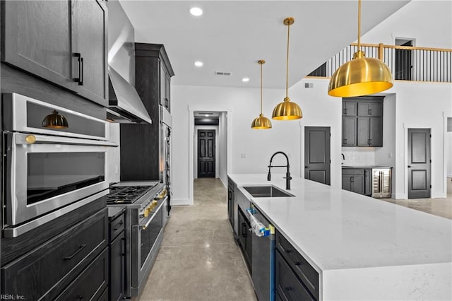 kitchen with a sink, visible vents, stainless steel appliances, recessed lighting, and a spacious island