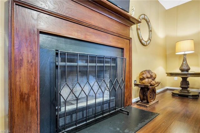 detailed view of baseboards and wood finished floors