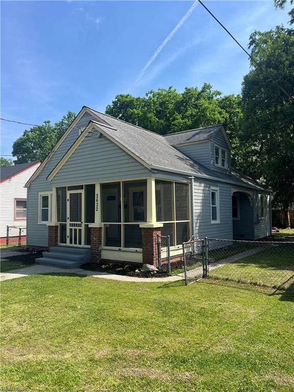 2622 Harrell Ave, Norfolk, VA 23509 - rear view of property featuring a sunroom and roof with shingles