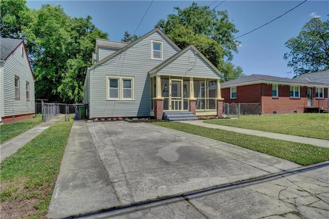 2622 Harrell Ave, Norfolk, VA 23509 - bungalow featuring a sunroom and a gate