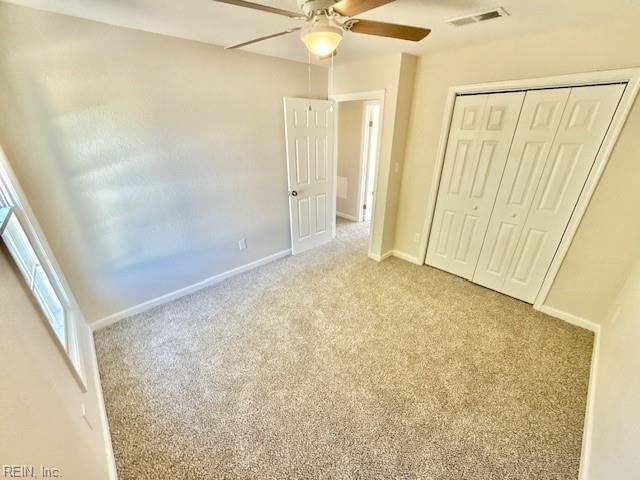 1761 Gravenhurst Dr, Virginia Beach, VA 23464 - unfurnished bedroom with light carpet, a closet, baseboards, and a ceiling fan