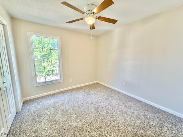 1761 Gravenhurst Dr, Virginia Beach, VA 23464 - carpeted empty room featuring baseboards and a ceiling fan