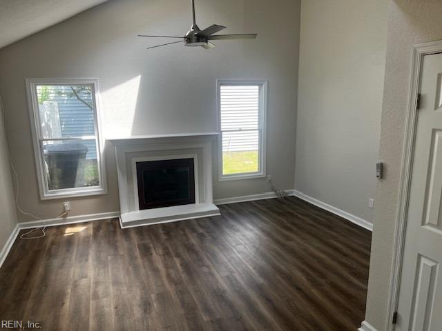 1761 Gravenhurst Dr, Virginia Beach, VA 23464 - unfurnished living room with wood finished floors, lofted ceiling, ceiling fan, baseboards, and a fireplace with raised hearth