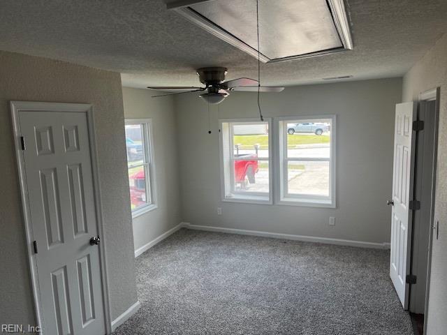 1761 Gravenhurst Dr, Virginia Beach, VA 23464 - unfurnished bedroom featuring attic access, a textured ceiling, carpet flooring, and baseboards