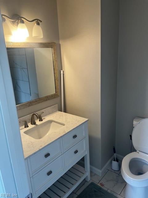 1761 Gravenhurst Dr, Virginia Beach, VA 23464 - half bath featuring marble look tile flooring, vanity, and toilet