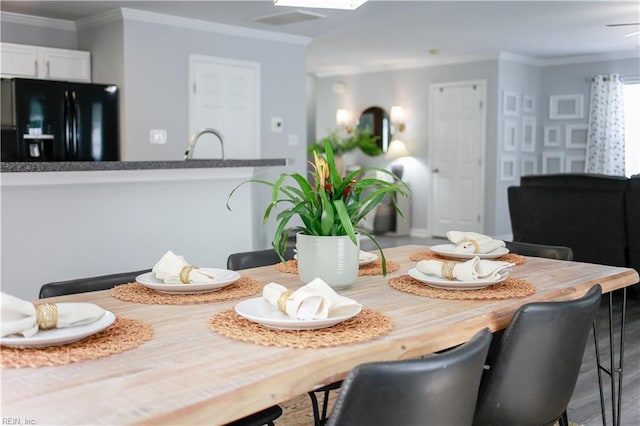 dining room featuring ornamental molding