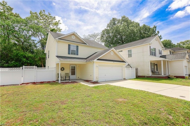 traditional-style home with covered porch, fence, an attached garage, and driveway