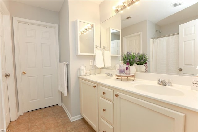 full bathroom featuring visible vents, a sink, and double vanity