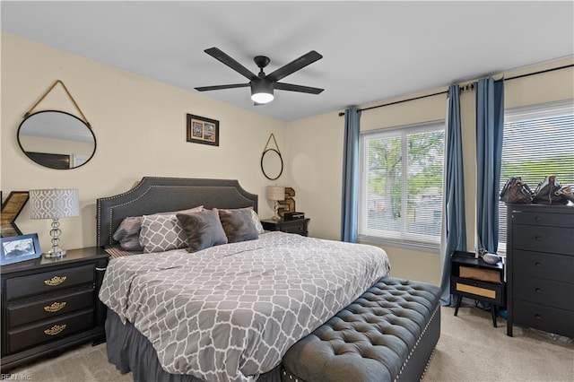 bedroom featuring ceiling fan and light colored carpet