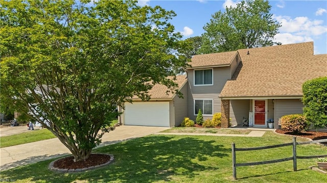 view of front facade with fence, a shingled roof, an attached garage, a front yard, and driveway