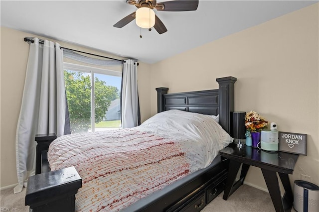 carpeted bedroom with baseboards and ceiling fan