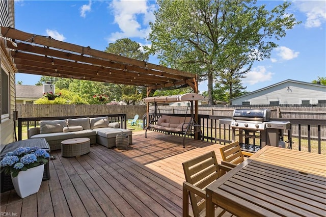 wooden deck featuring an outdoor hangout area, grilling area, a pergola, and a fenced backyard