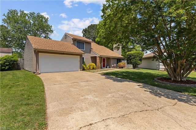 traditional-style home featuring a garage, a front lawn, driveway, and a chimney