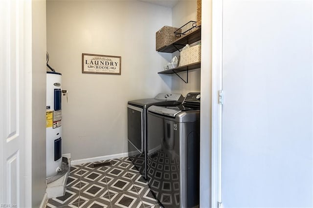 laundry room with laundry area, washer and dryer, baseboards, tile patterned floors, and electric water heater