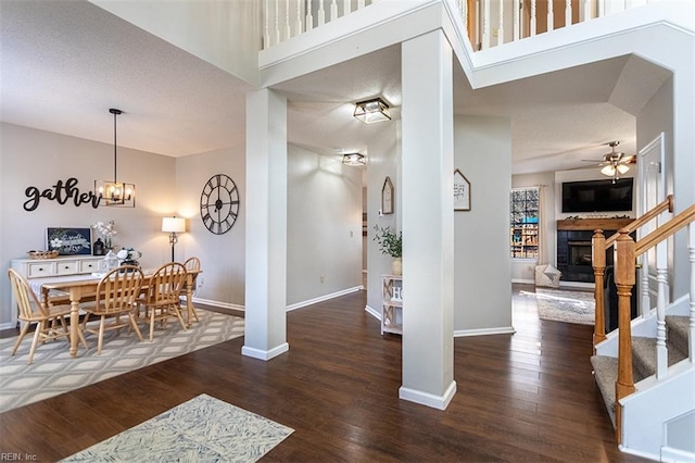 entrance foyer featuring baseboards and wood finished floors