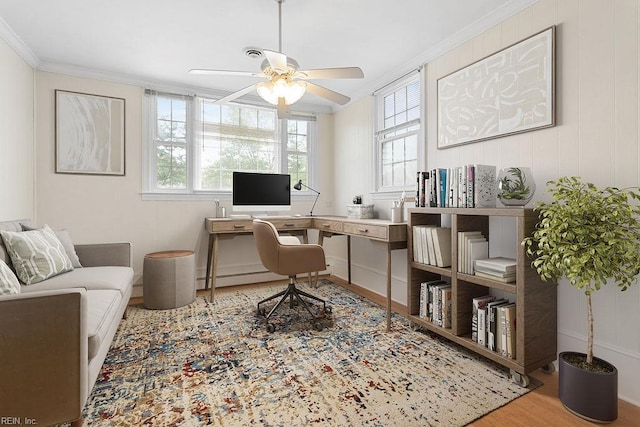 office featuring ceiling fan, ornamental molding, and wood finished floors