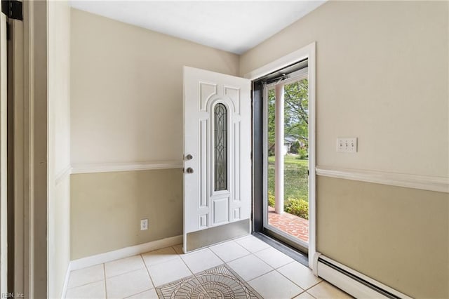 tiled foyer featuring baseboards and a baseboard radiator