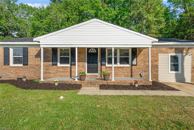2050 Midway Ave, Chesapeake, VA 23324 - single story home featuring covered porch, a front lawn, and brick siding