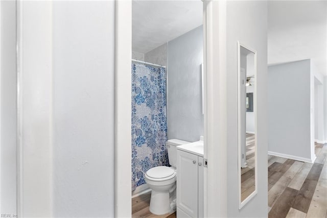2050 Midway Ave, Chesapeake, VA 23324 - full bathroom featuring vanity, wood finished floors, curtained shower, toilet, and a ceiling fan