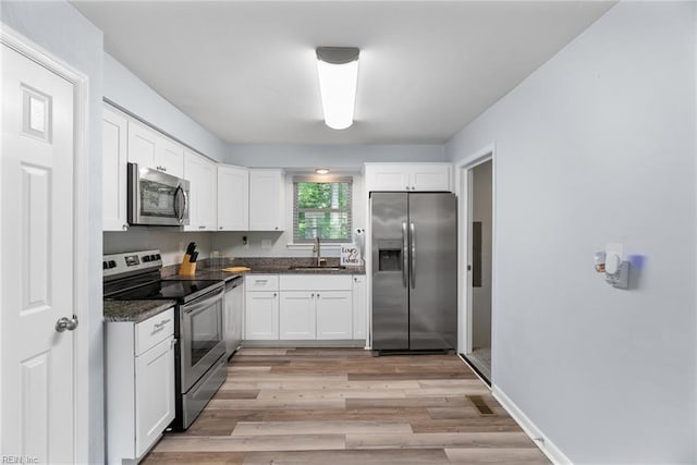 2050 Midway Ave, Chesapeake, VA 23324 - kitchen featuring a sink, white cabinets, and stainless steel appliances