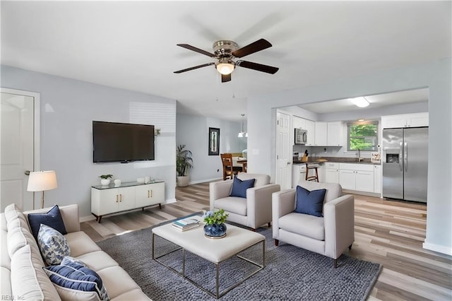 2050 Midway Ave, Chesapeake, VA 23324 - living area featuring light wood-style floors, baseboards, and ceiling fan