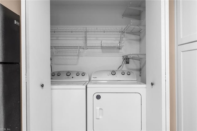laundry room featuring separate washer and dryer