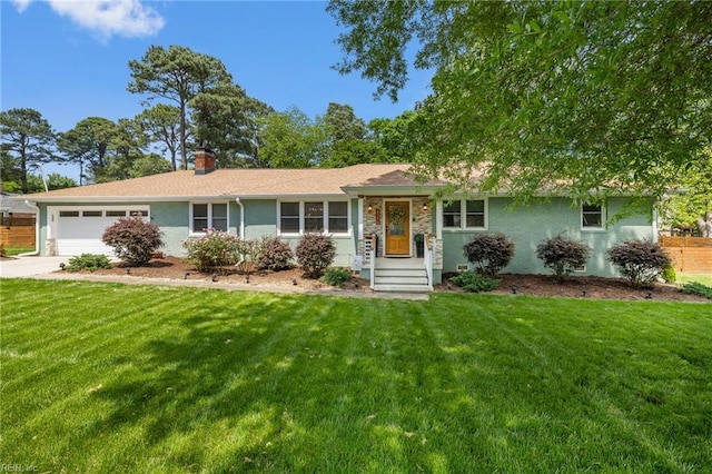 ranch-style home with a chimney, a garage, driveway, and a front yard
