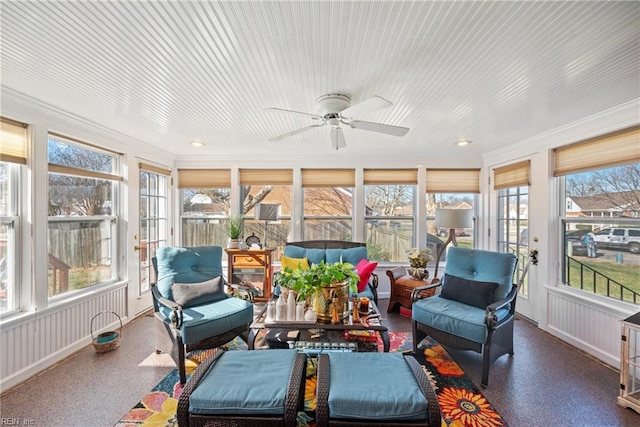 sunroom / solarium with an outdoor hangout area, plenty of natural light, and ceiling fan