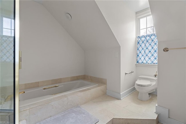 bathroom featuring a garden tub, tile patterned flooring, lofted ceiling, toilet, and walk in shower