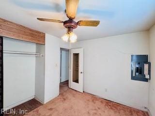 unfurnished bedroom featuring a closet, carpet flooring, and ceiling fan