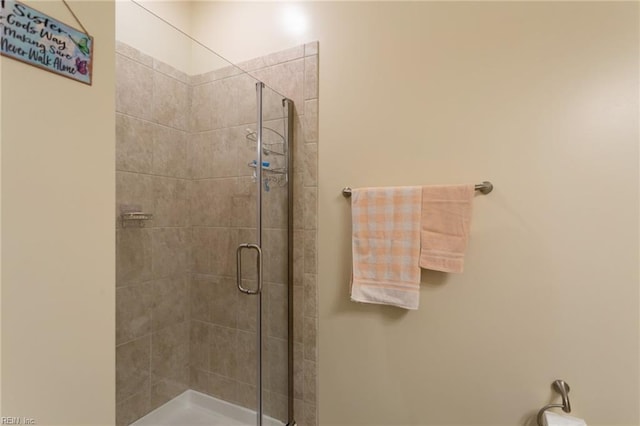 bathroom featuring a stall shower