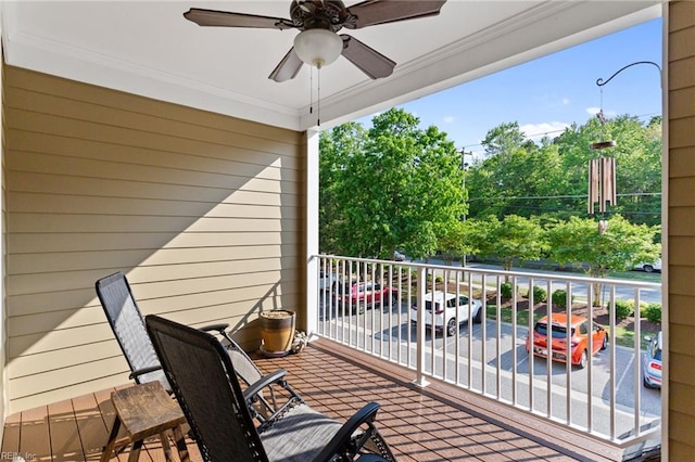 wooden deck featuring a ceiling fan