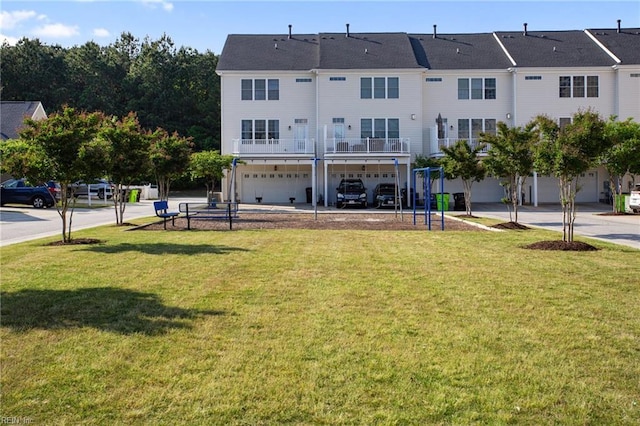 rear view of property with a lawn