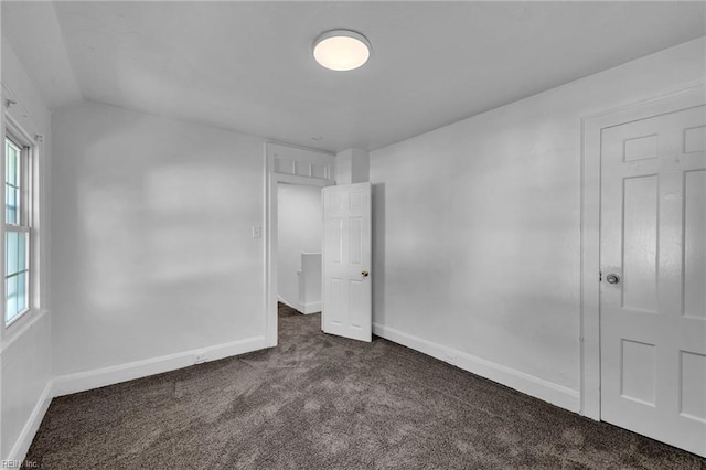 37 Farragut St, Portsmouth, VA 23702 - unfurnished bedroom featuring dark colored carpet, baseboards, and multiple windows