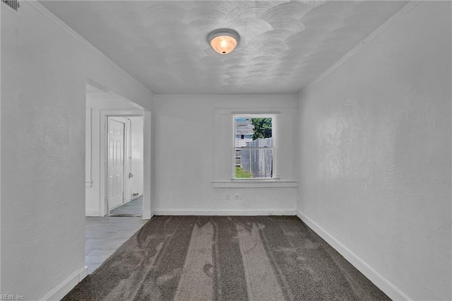 37 Farragut St, Portsmouth, VA 23702 - spare room featuring visible vents, crown molding, carpet floors, baseboards, and a textured wall