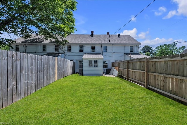 37 Farragut St, Portsmouth, VA 23702 - back of house featuring a lawn, a fenced backyard, and a shingled roof