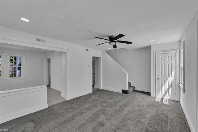 37 Farragut St, Portsmouth, VA 23702 - unfurnished living room featuring carpet flooring, ceiling fan, baseboards, visible vents, and stairway
