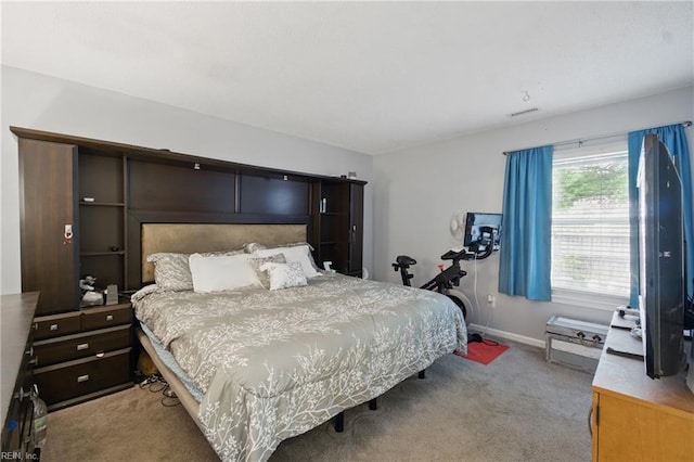 bedroom with light colored carpet, baseboards, and visible vents
