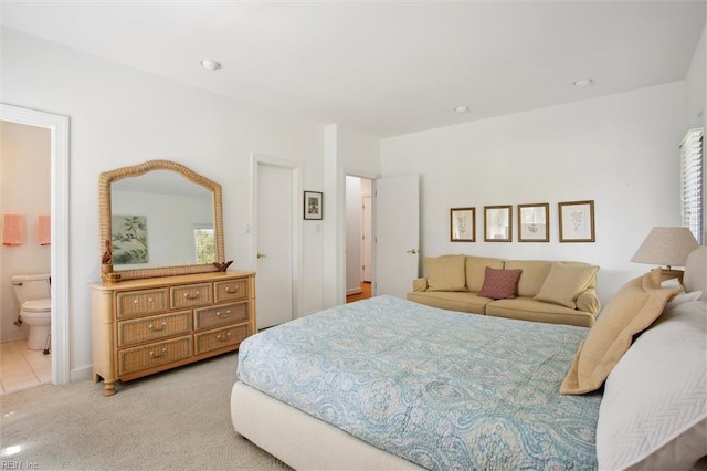bedroom featuring carpet floors and connected bathroom