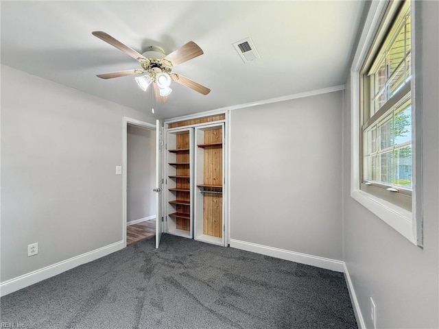 2015 Neville Cir, Hampton, VA 23663 - unfurnished bedroom with baseboards, visible vents, ceiling fan, and dark colored carpet