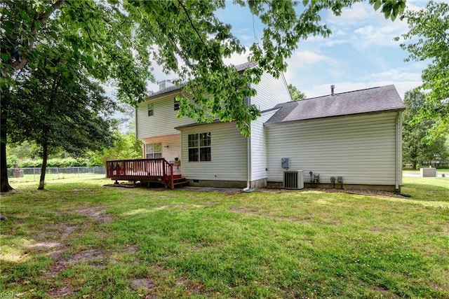 back of house featuring a deck and cooling unit