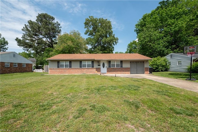 ranch-style home featuring brick siding, an attached garage, driveway, and a front yard