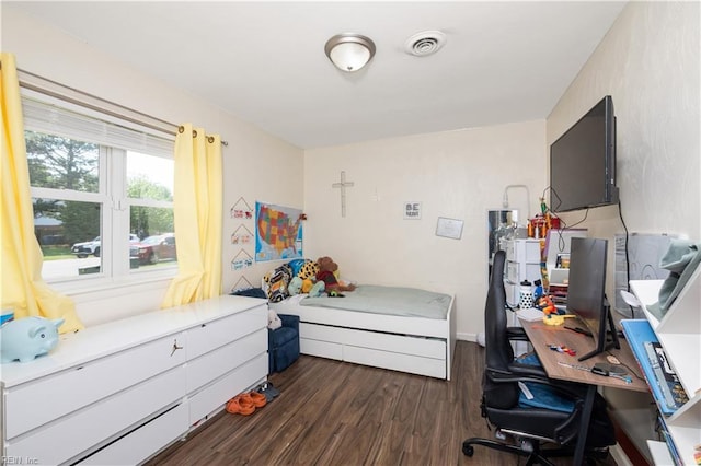 bedroom with visible vents and dark wood-style floors