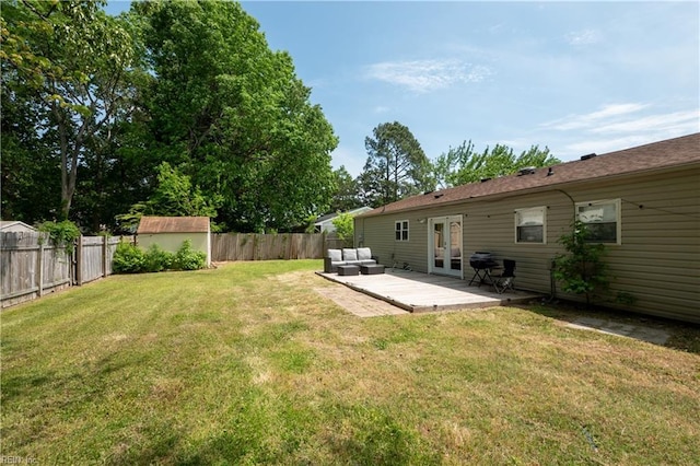 view of yard with a fenced backyard, a patio area, french doors, and an outdoor hangout area