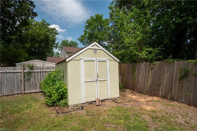 view of shed with a fenced backyard