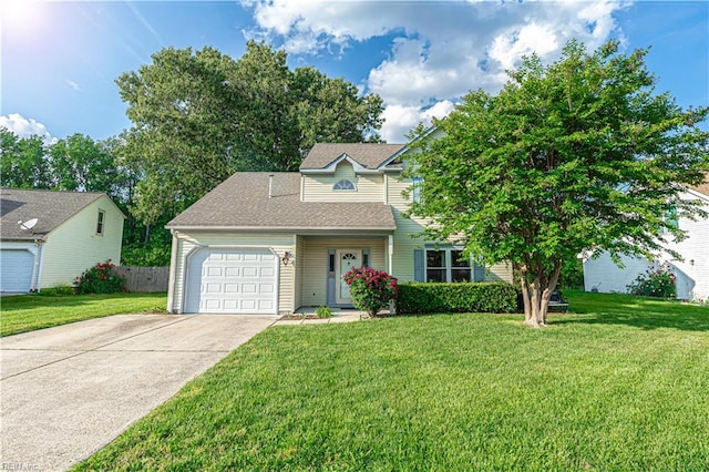 view of front of house featuring driveway, a front lawn, and a garage