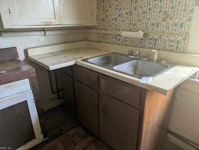 kitchen with light countertops and a sink