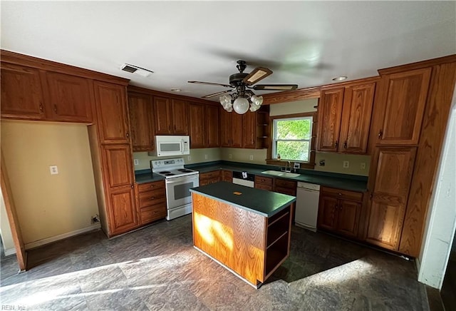 kitchen featuring visible vents, dark countertops, open shelves, a sink, and white appliances